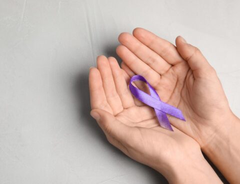Purple ribbon in honor of domestic violence awareness month.